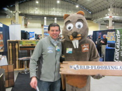 The World Flooring & More mascot with owner