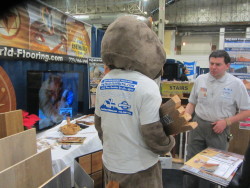 flooring mascot in a tshirt