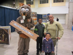 Dad with sons and the beaver mascot